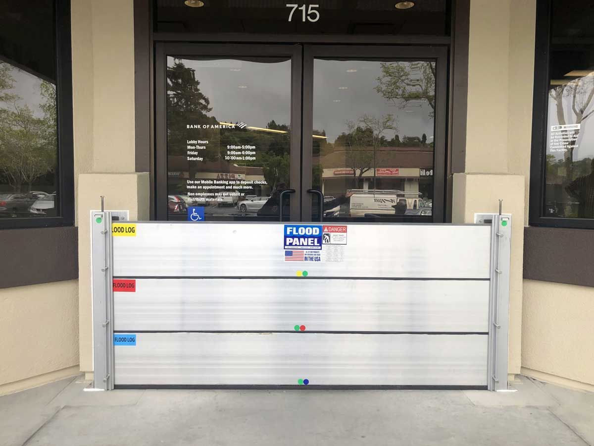 A flood barrier is sitting in front of a building.