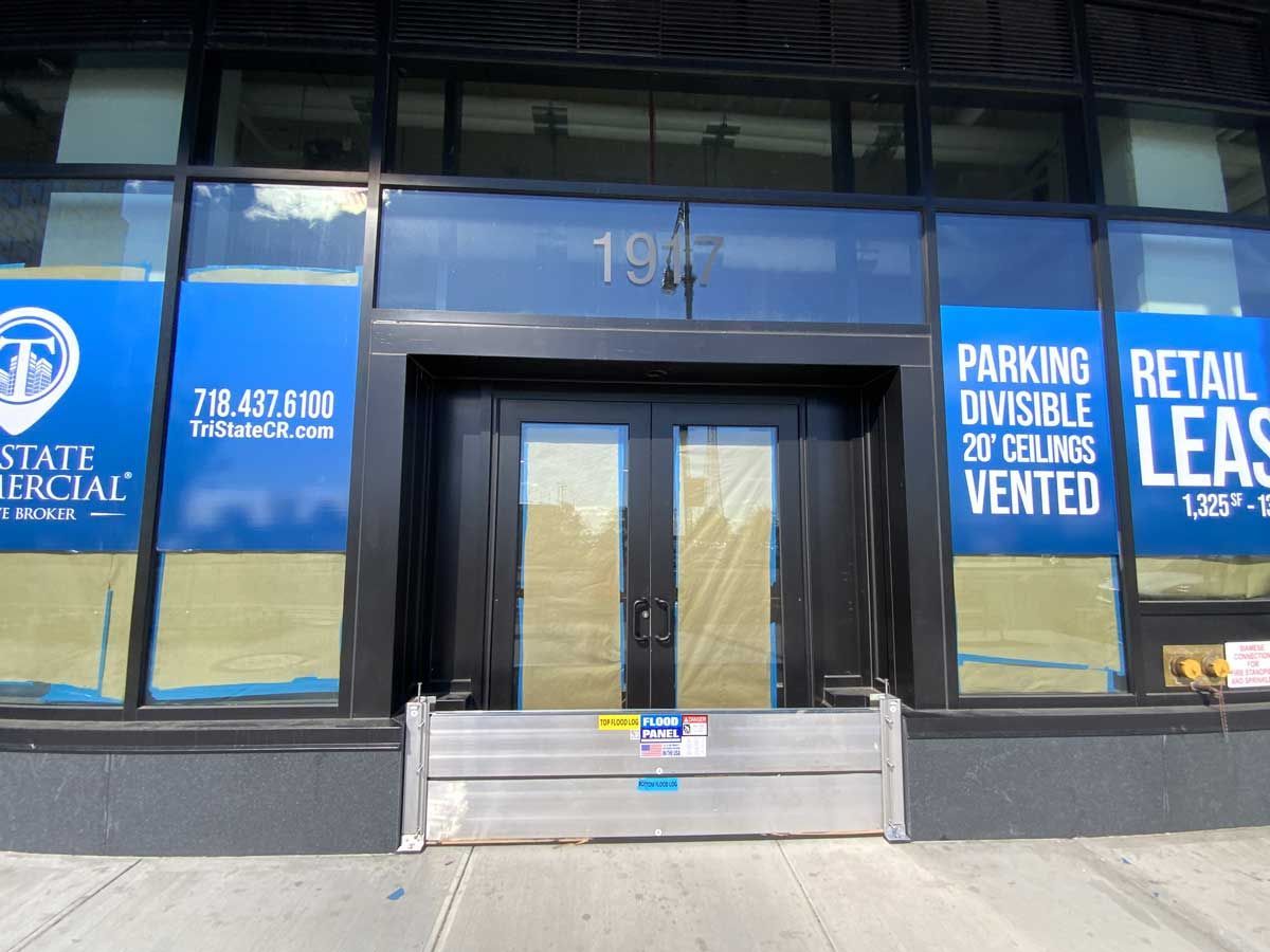 A building with a sign that says parking retail leas vented