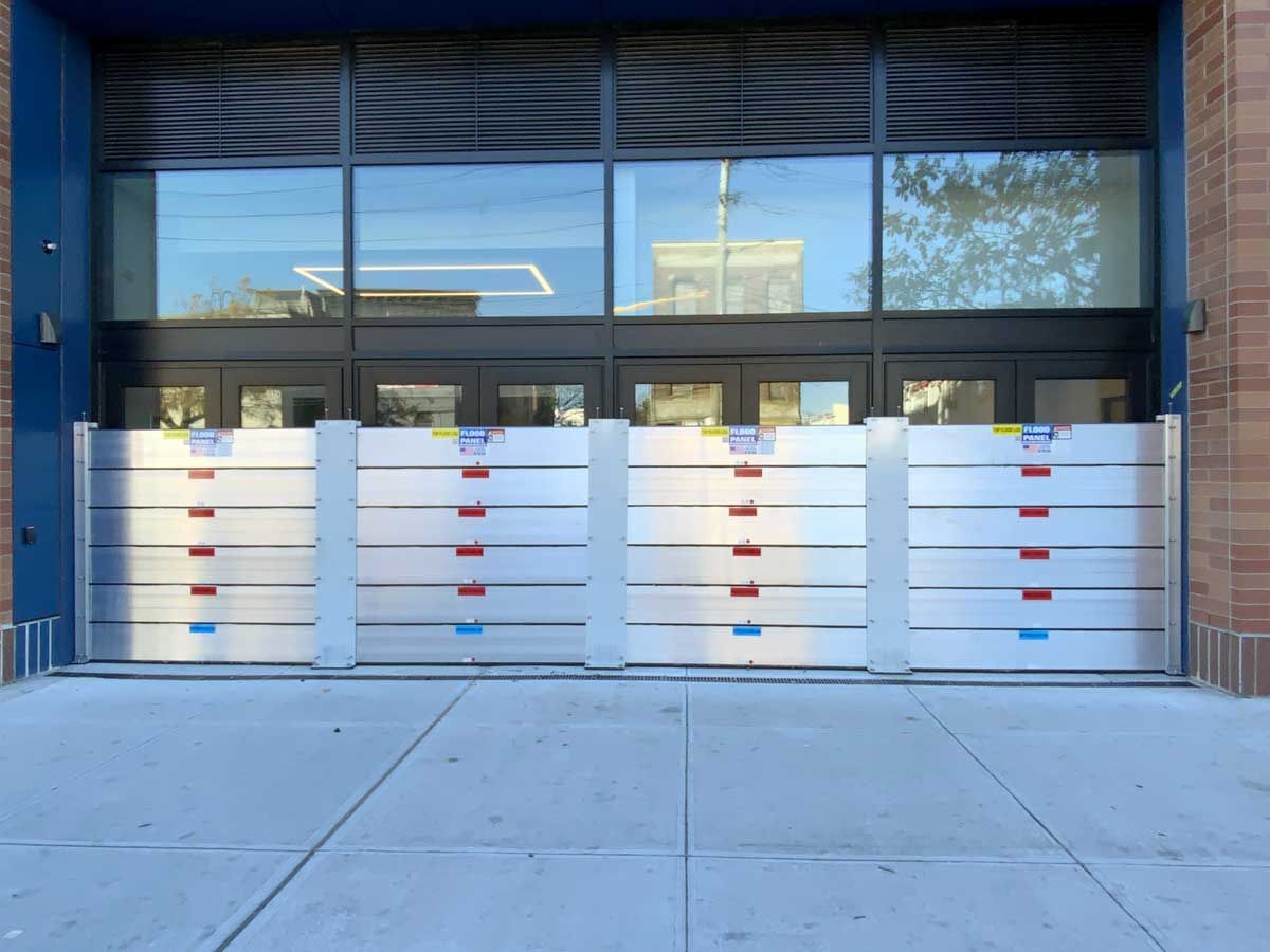 A building with a flood barrier in front of it.