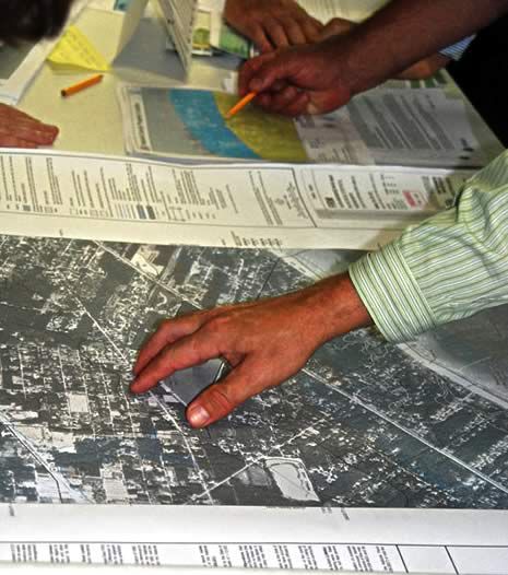 A group of people are looking at an aerial view of a city