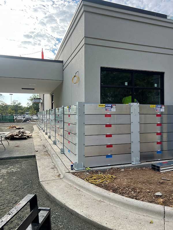 A building under construction with a fence around it.