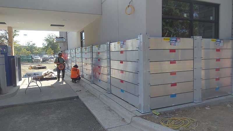 A group of people are standing in front of a building.