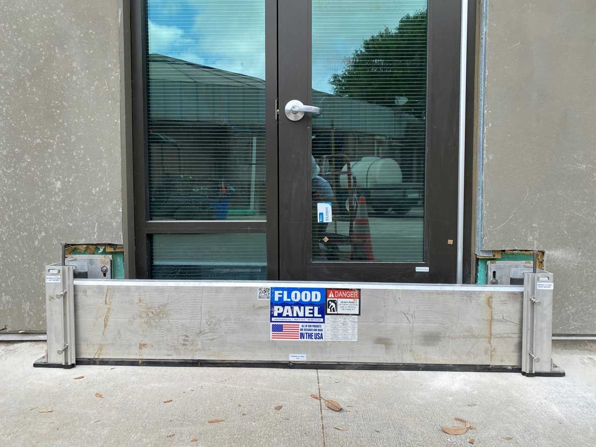 A door with a flood panel attached to it