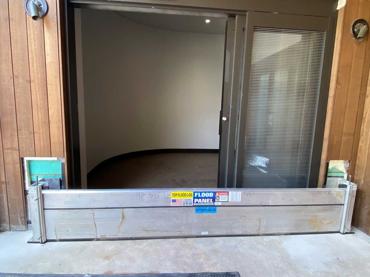 A flood barrier is sitting in front of a door.