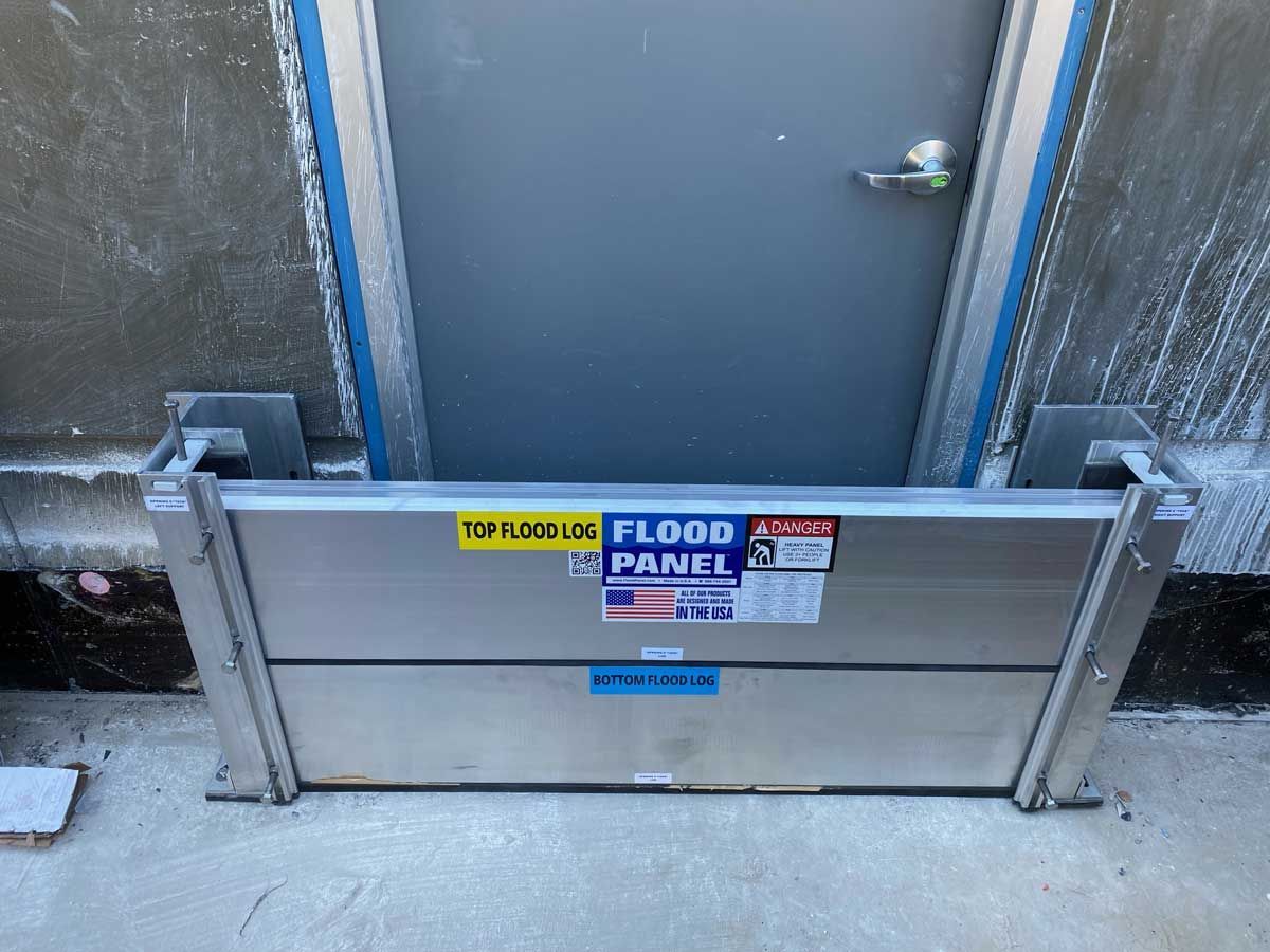 A flood panel is sitting in front of a door.