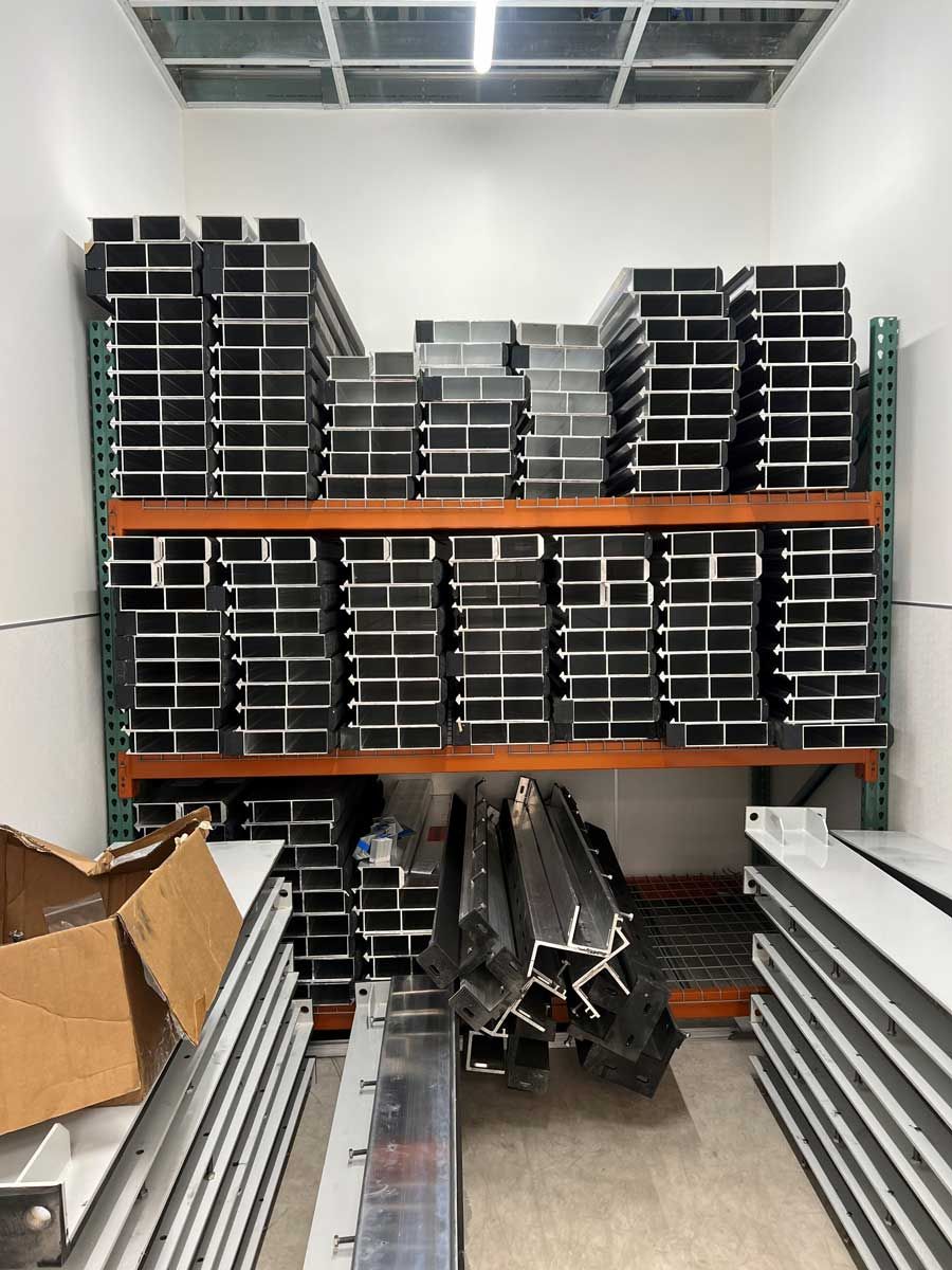 A room filled with lots of metal pieces on shelves.