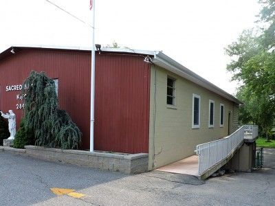 A large red building with a ramp leading to it