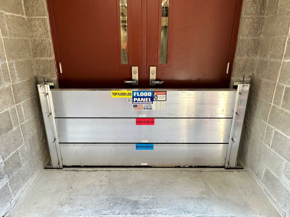 A flood barrier is sitting in front of a door.