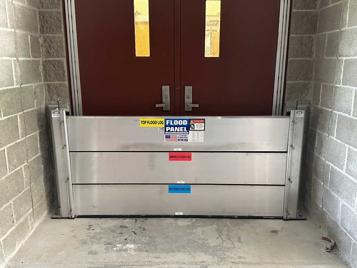 A flood barrier is sitting in front of a door.