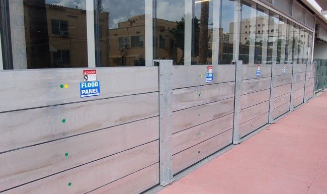 A wooden wall with a sign that says flood panel on it