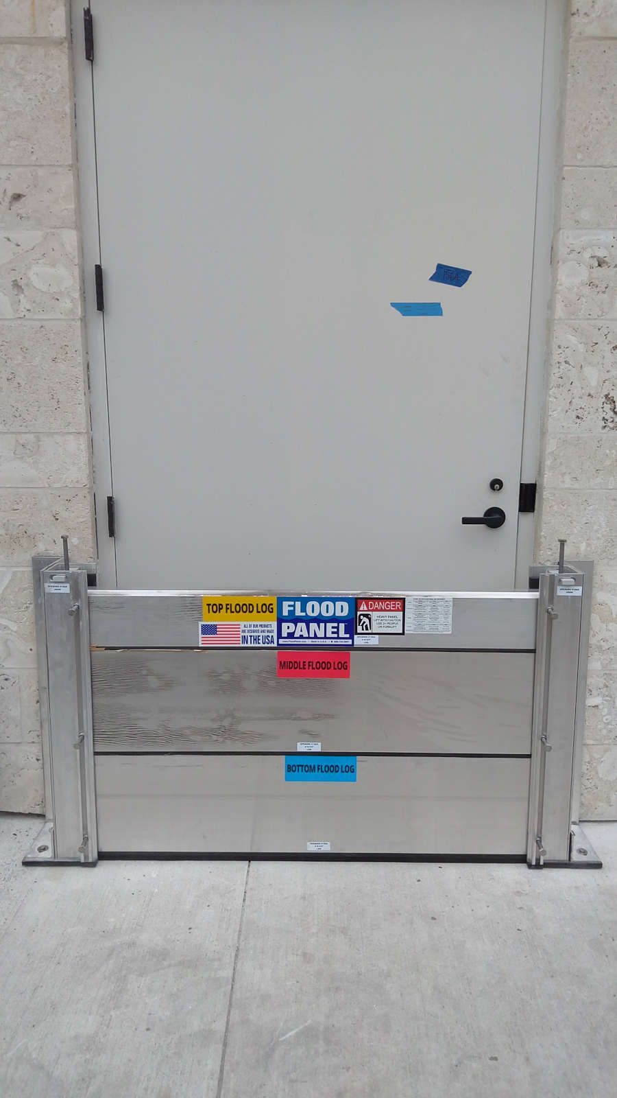 A door with a flood barrier attached to it.