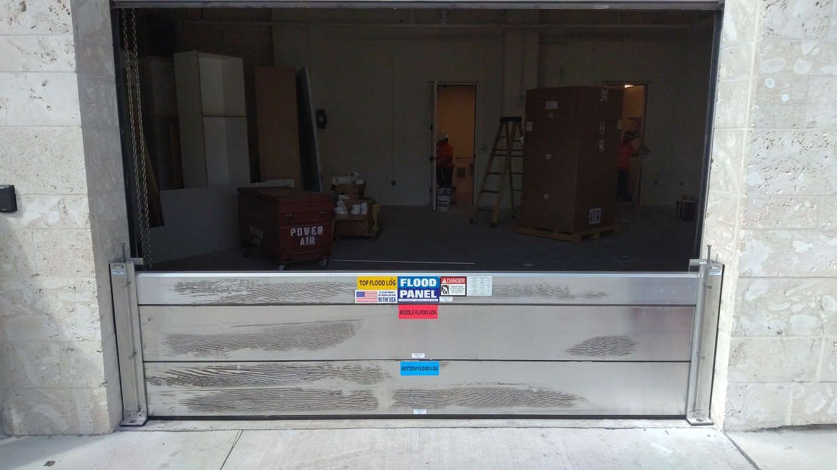 A garage door with a flood barrier attached to it.
