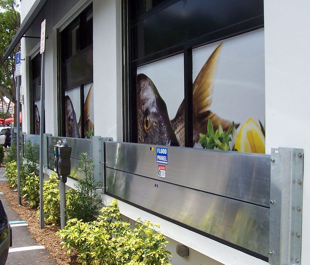 A stainless steel wall with a picture of fish on it