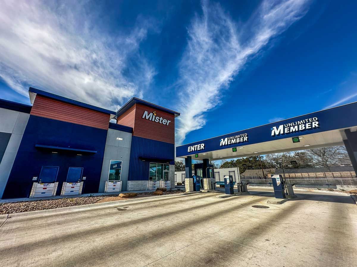 A picture of a gas station with a blue sky in the background.