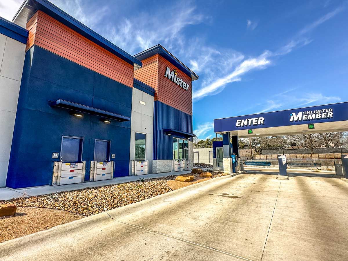 A blue and white building with a sign that says enter member