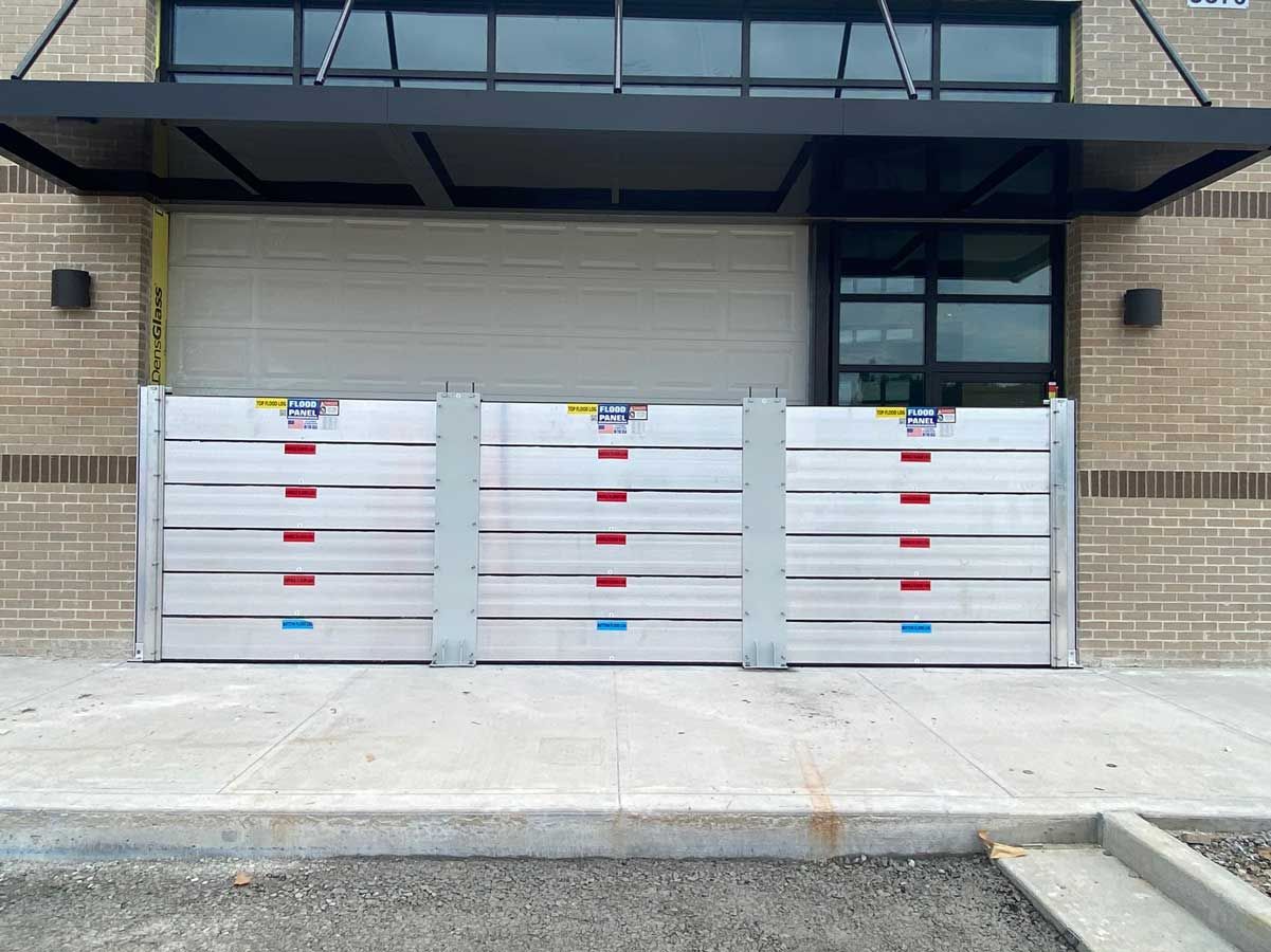 A building with a flood barrier in front of it.