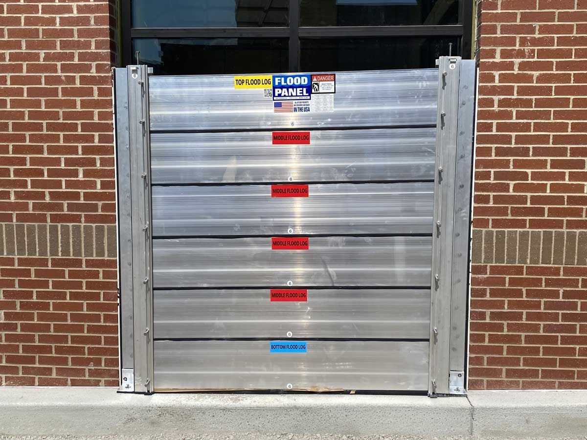 A brick building with a flood barrier on it