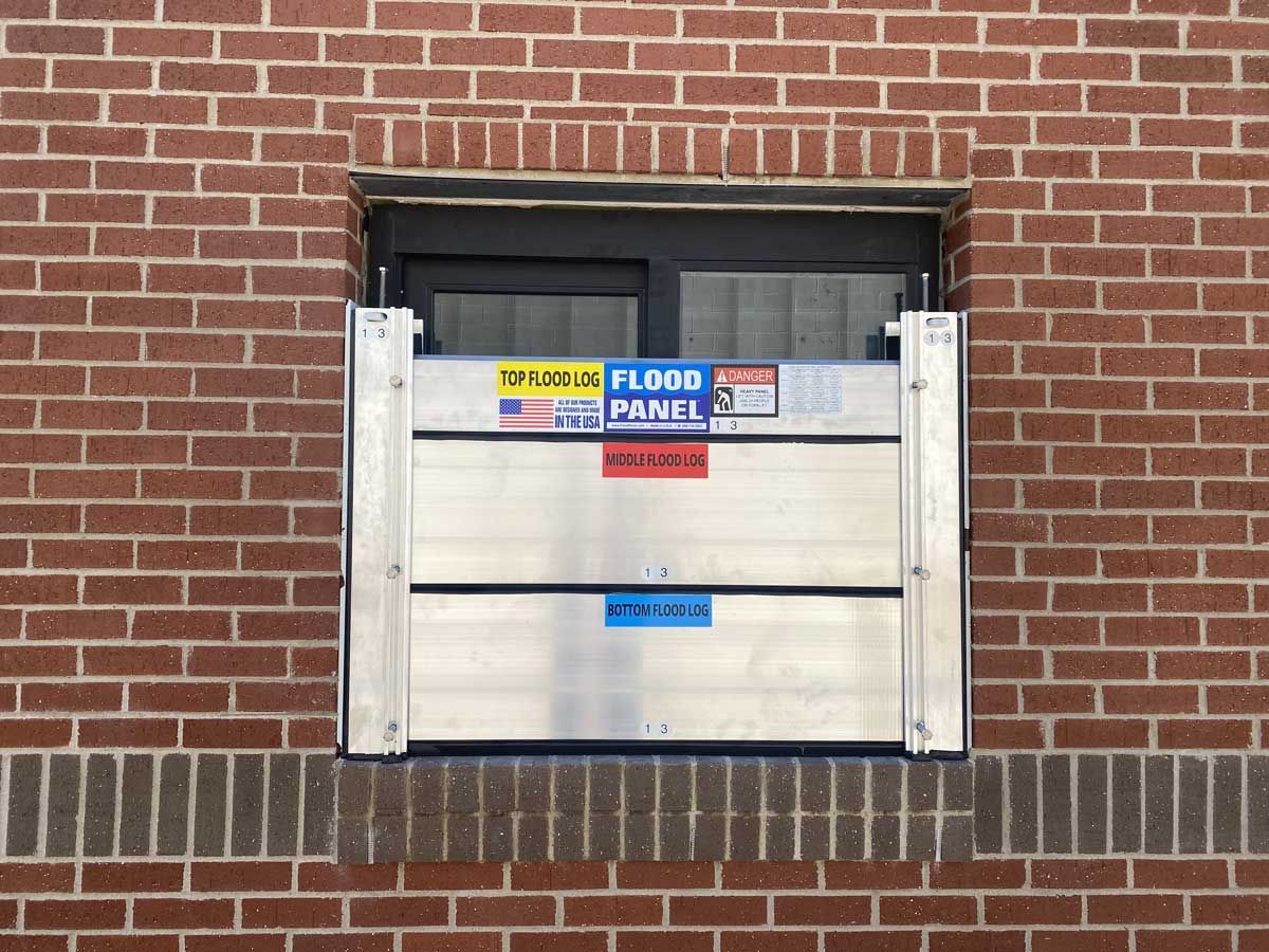 A brick wall with a flood panel on it
