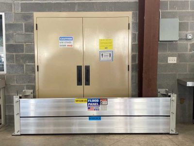 A flood barrier is sitting in front of a door
