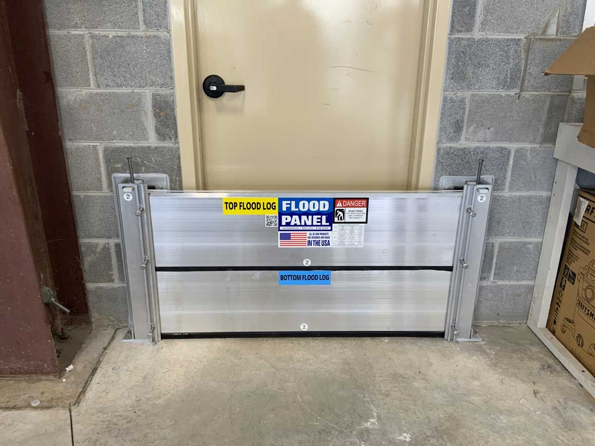 A flood panel is sitting in front of a door.