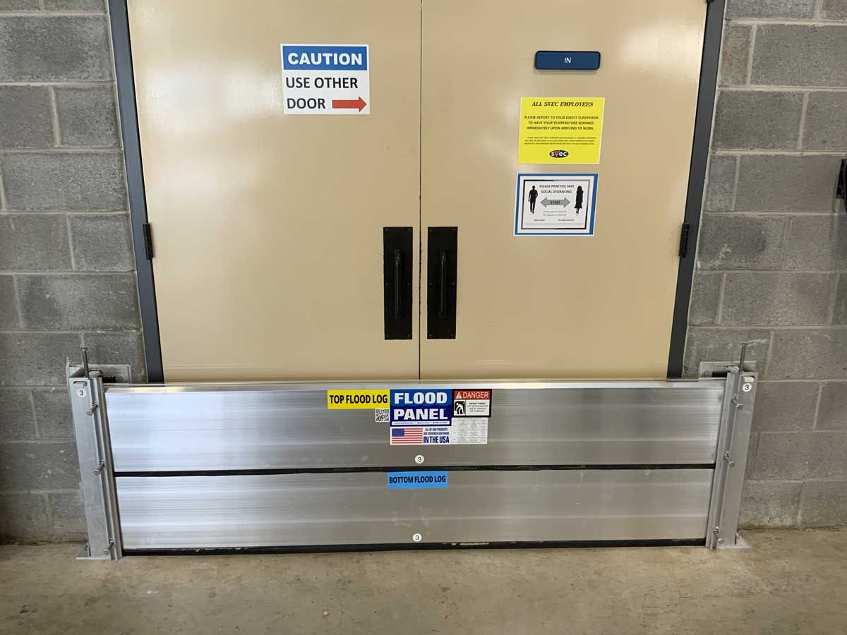 A door with a sign on it that says caution