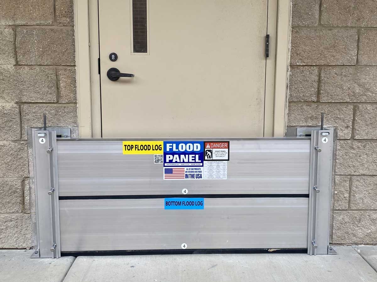 A door with a flood panel in front of it