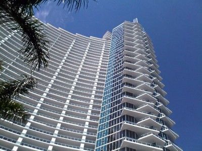 Looking up at a tall building with a blue sky in the background