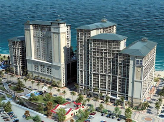 An aerial view of a large building next to the ocean