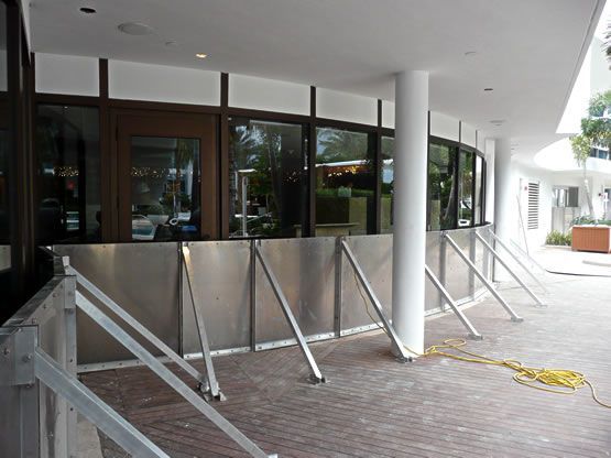 A building with a lot of windows and a stainless steel wall