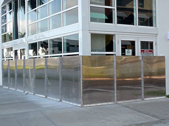 A building with a stainless steel fence around it