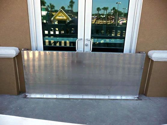 A door with a metal barrier in front of it