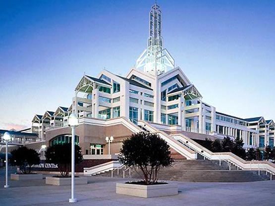 A large white building with stairs leading up to it