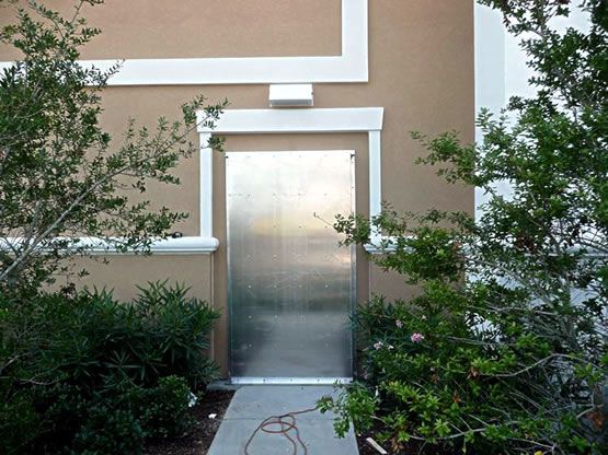 A stainless steel door on the side of a building