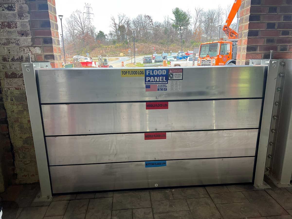 A flood panel is sitting in front of a brick wall