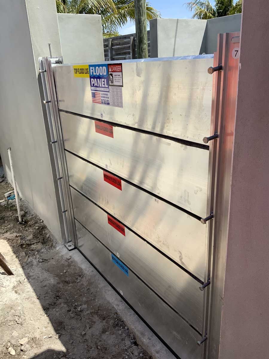 A flood barrier is sitting on the side of a building.