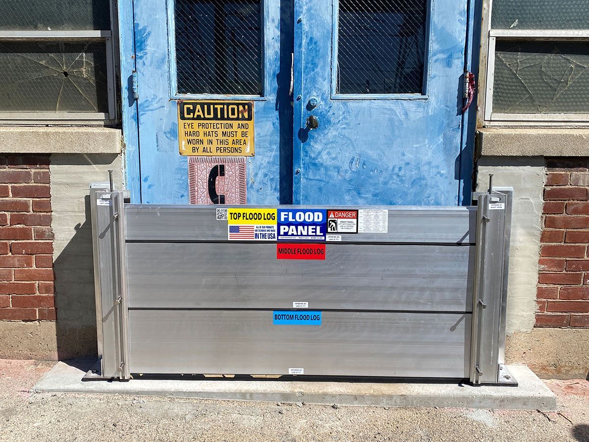 A blue door with a caution sign on it