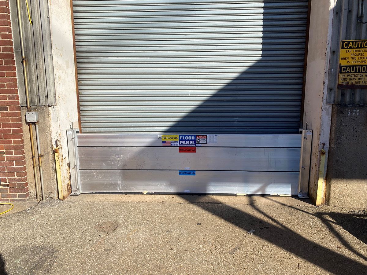 A garage door with a flood barrier attached to it.