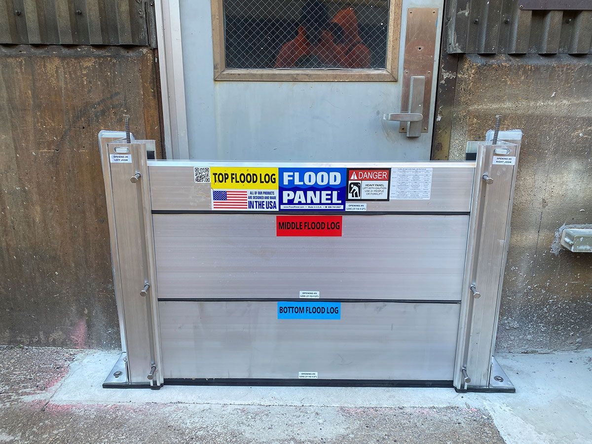 A flood panel is installed in front of a door