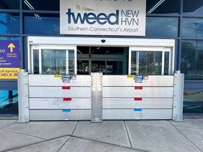A building with a sign that says tweed new hvn southern connecticut 's airport.
