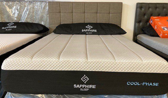 A bed with a mattress that says sapphire sleep on it