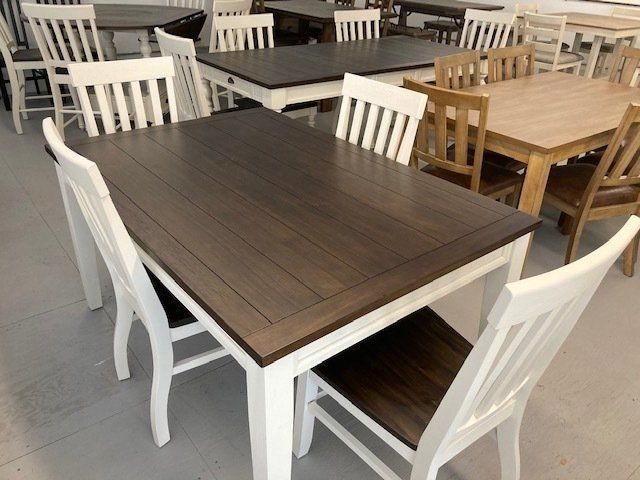 A row of tables and chairs in a store