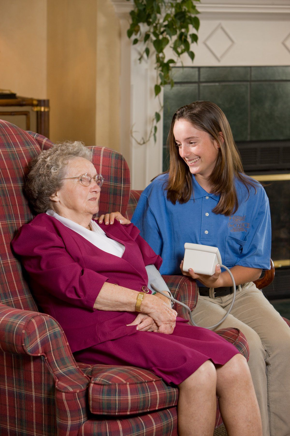 Health visitor and a senior woman during home visit