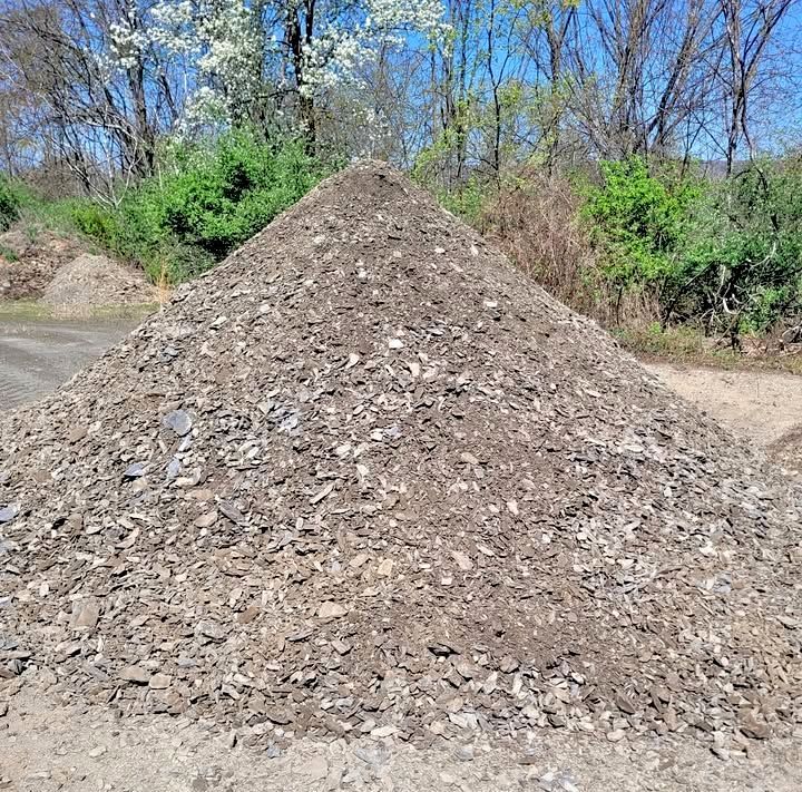Stacks of wooden pallets for sale, $2.00 a piece.