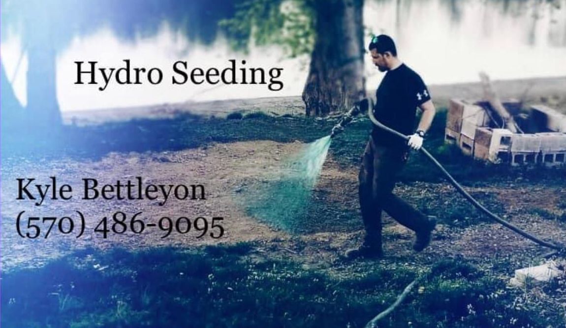 Man hydro seeding grass. Text: Hydro Seeding, Kyle Bettleyon (570) 486-9095. Outdoors near water, blue tint.