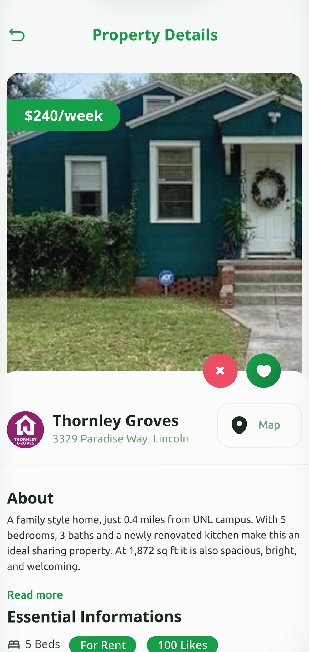 A picture of a blue house with a wreath on the front door.