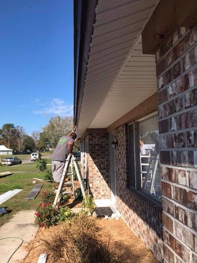 Carpentry — Man Fixing The Roof in Greencove Springs, FL