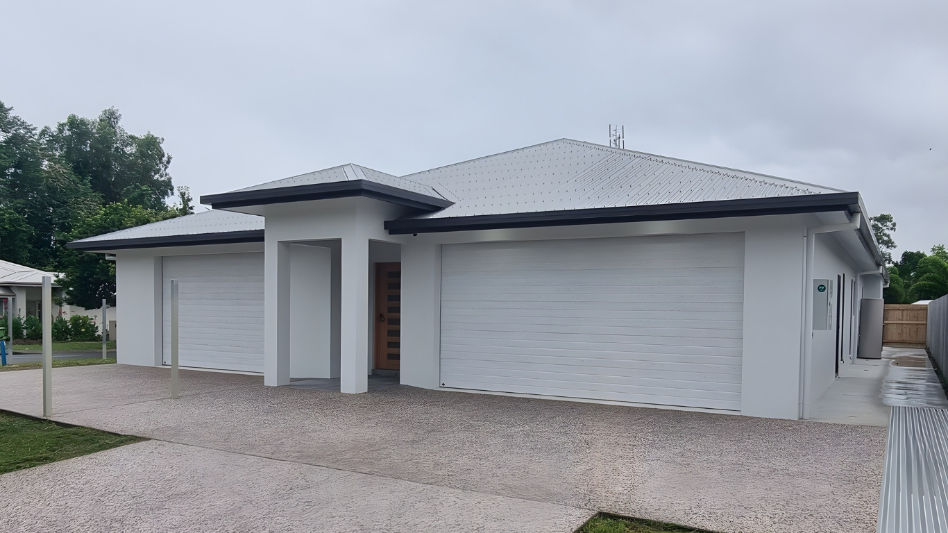 Kitchen Featuring White Island and Black Cabinets — Home Builder in Townsville, QLD