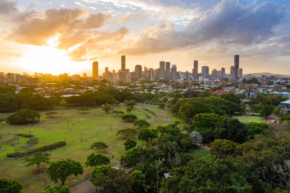 Aerial View Of A Park With A City Skyline At Sunset — Fireline 2000 Fire Equipment Pty Ltd in Brisbane, QLD