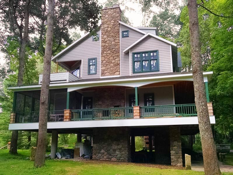 Photo of a multi-story residential home with stone masonry covering an elevator shaft and support columns in Williamsport, PA.