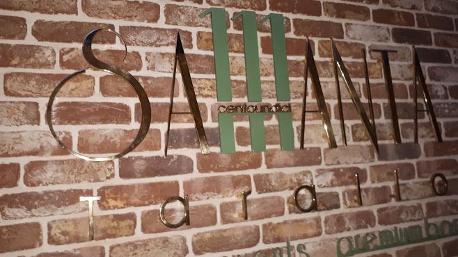 Realizzazione insegna in ottone lucido